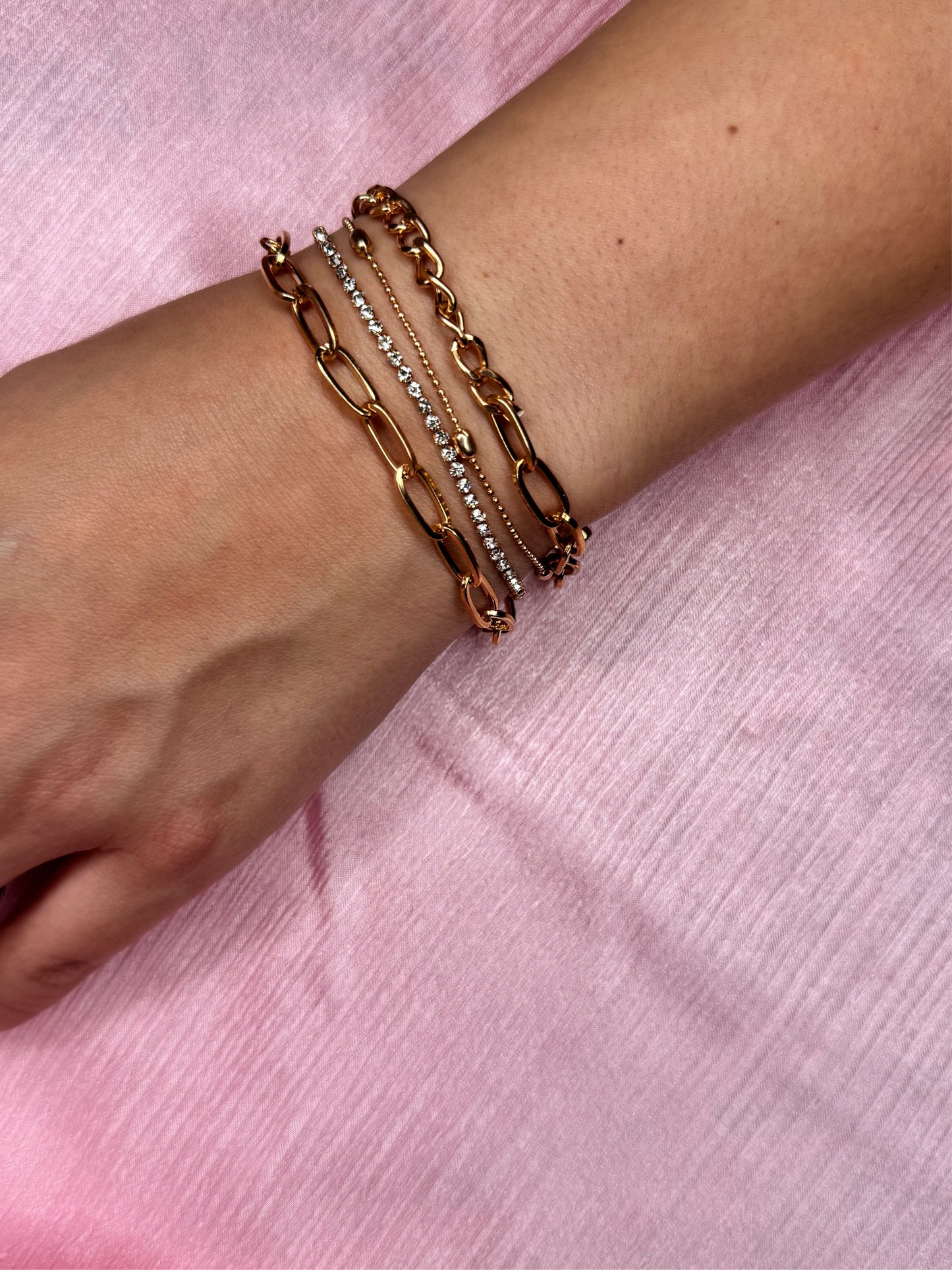 Golden layered bracelet stack