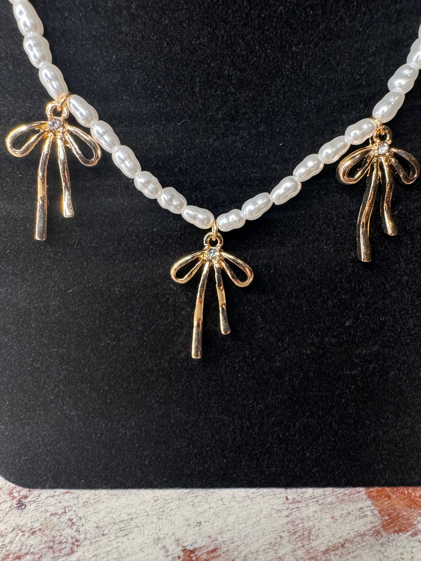 Bow Charm, Pearl adorned necklace